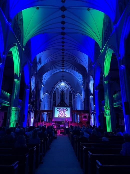 Church lit with blue and green uplighters